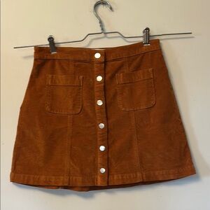 Urban Outfitters snap front brushed finish rust coloured mini skirt size M. NWOT